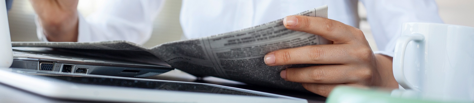 business-woman-reading-newspaper