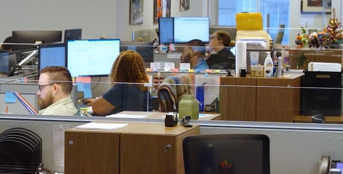 CLT Employees at their desks